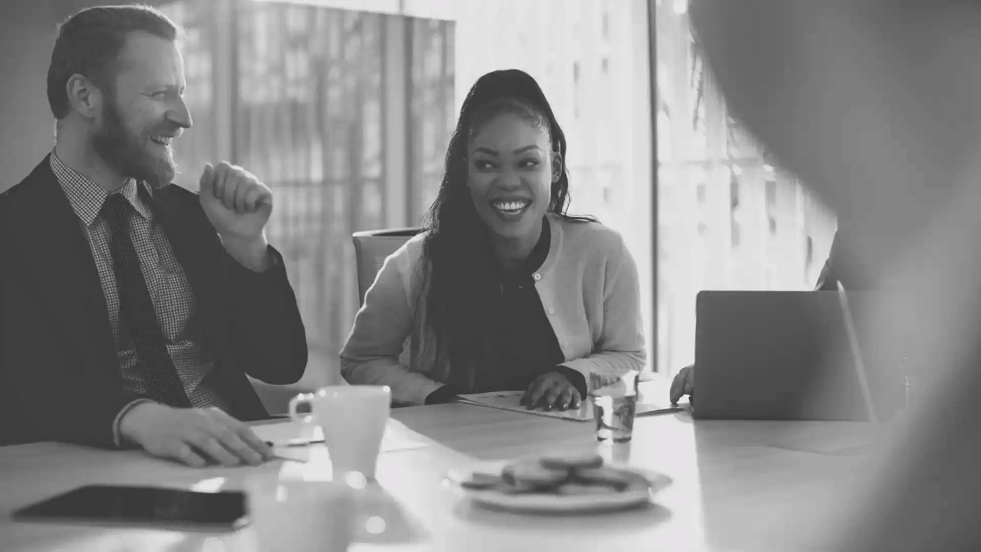Smiling people at a table